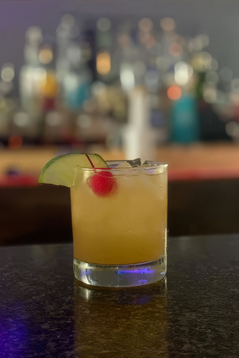 Craft cocktail with lime garnish served at a local bar near Caledonia, Mississippi