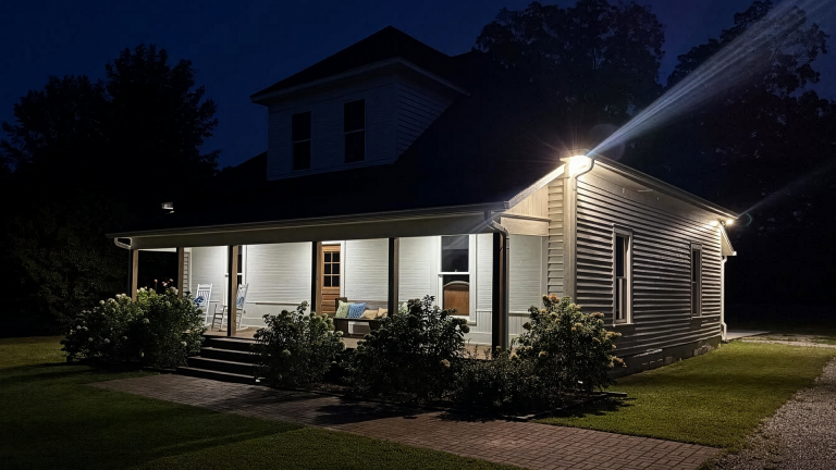 Illuminated 1920s historic farmhouse venue at night Old Fashioned Events Caledonia MS